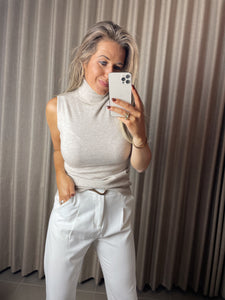 Sleeveless beige turtleneck