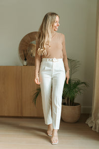 White pants with golden buckle